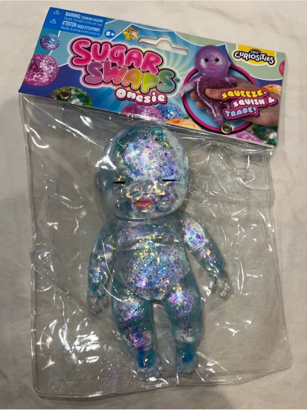 Baby Sugar Swaps Glitter Squishy Onesie Doll - Blue & Purple